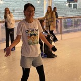 Boarders ice skating.