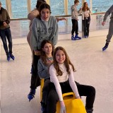 Boarders ice skating.