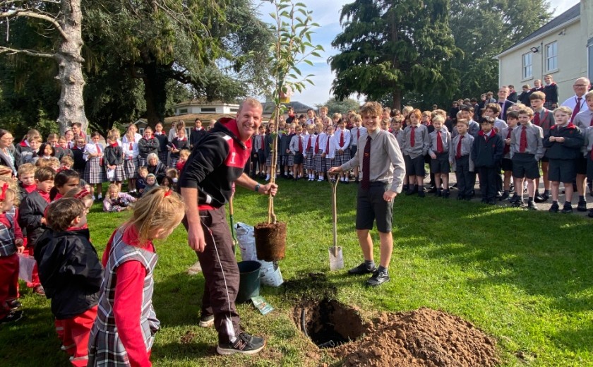 all pupils watching the kindness tree be planted