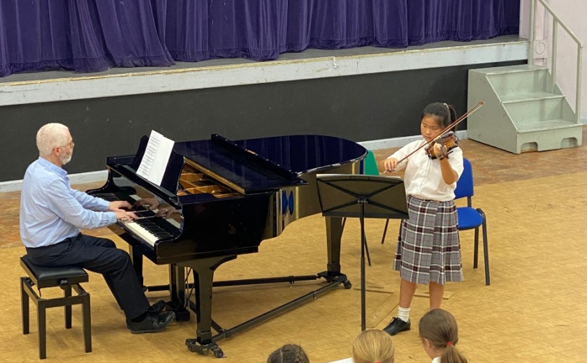 Individual performer playing violin