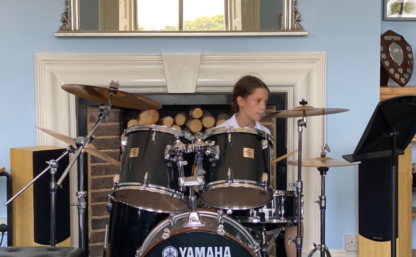 Individual performer playing drums