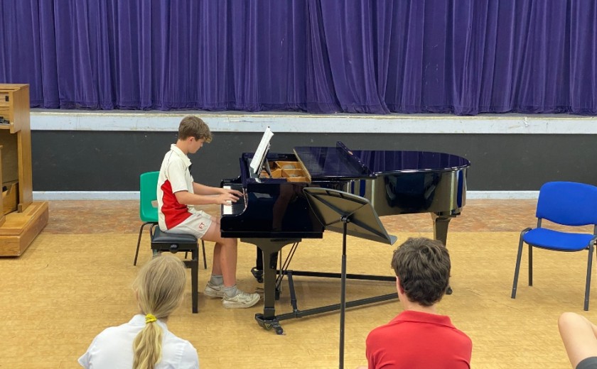 Individual performer playing piano