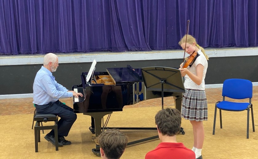 Individual performer playing violin