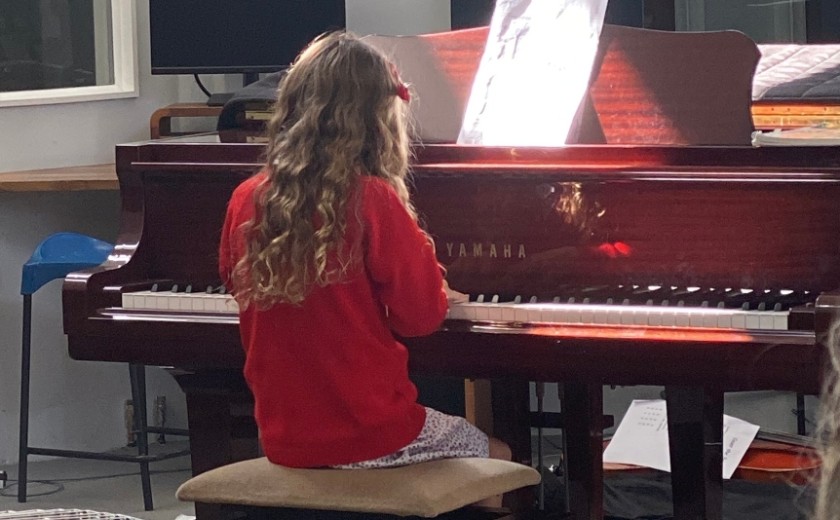 girl playing piano