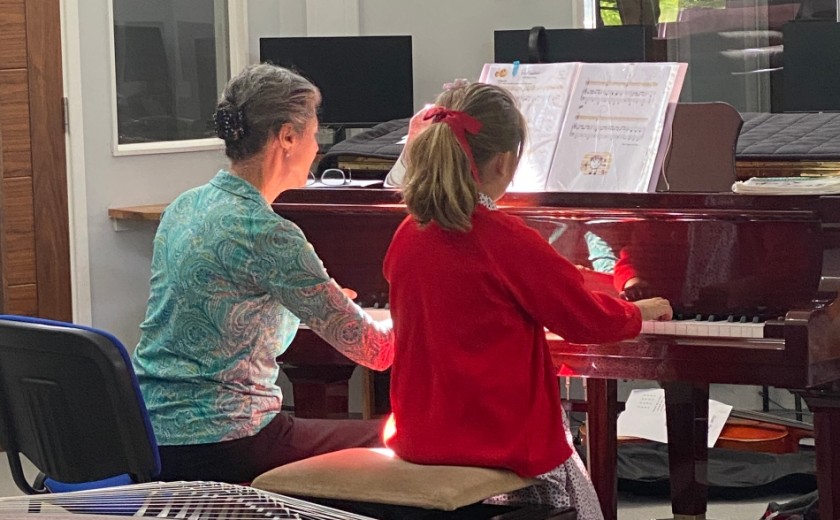 girl playing piano