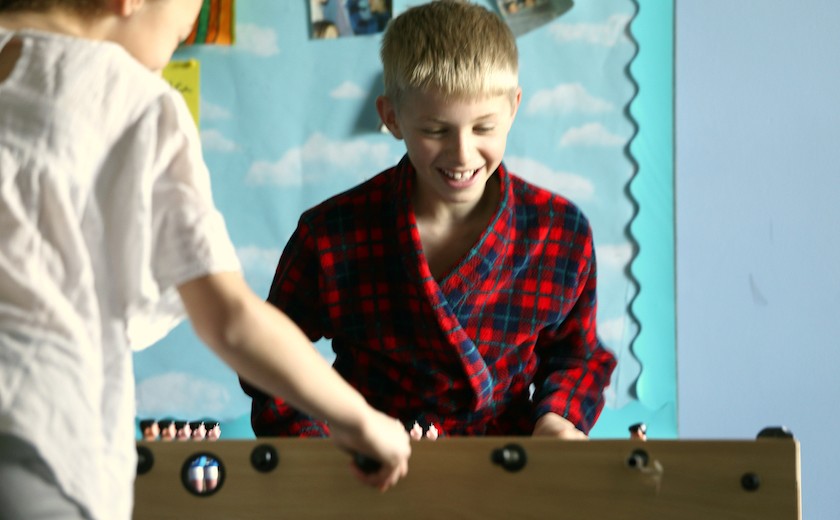 boarders playing table football