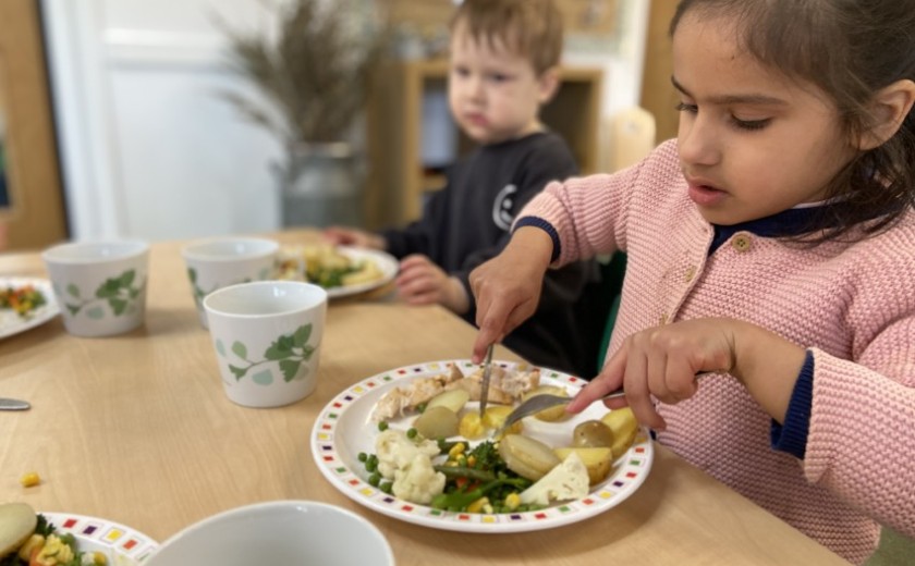 girl eats roast lunch delivered fresh to the Pre-Prep