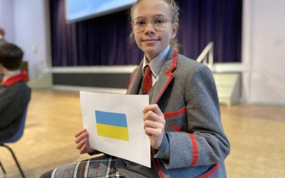 ukrainian flag held up by girl