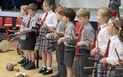 world music day - children playing percussion instruments