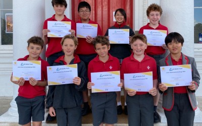 math's challenge winners holding their certificates