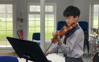 boy plays violin